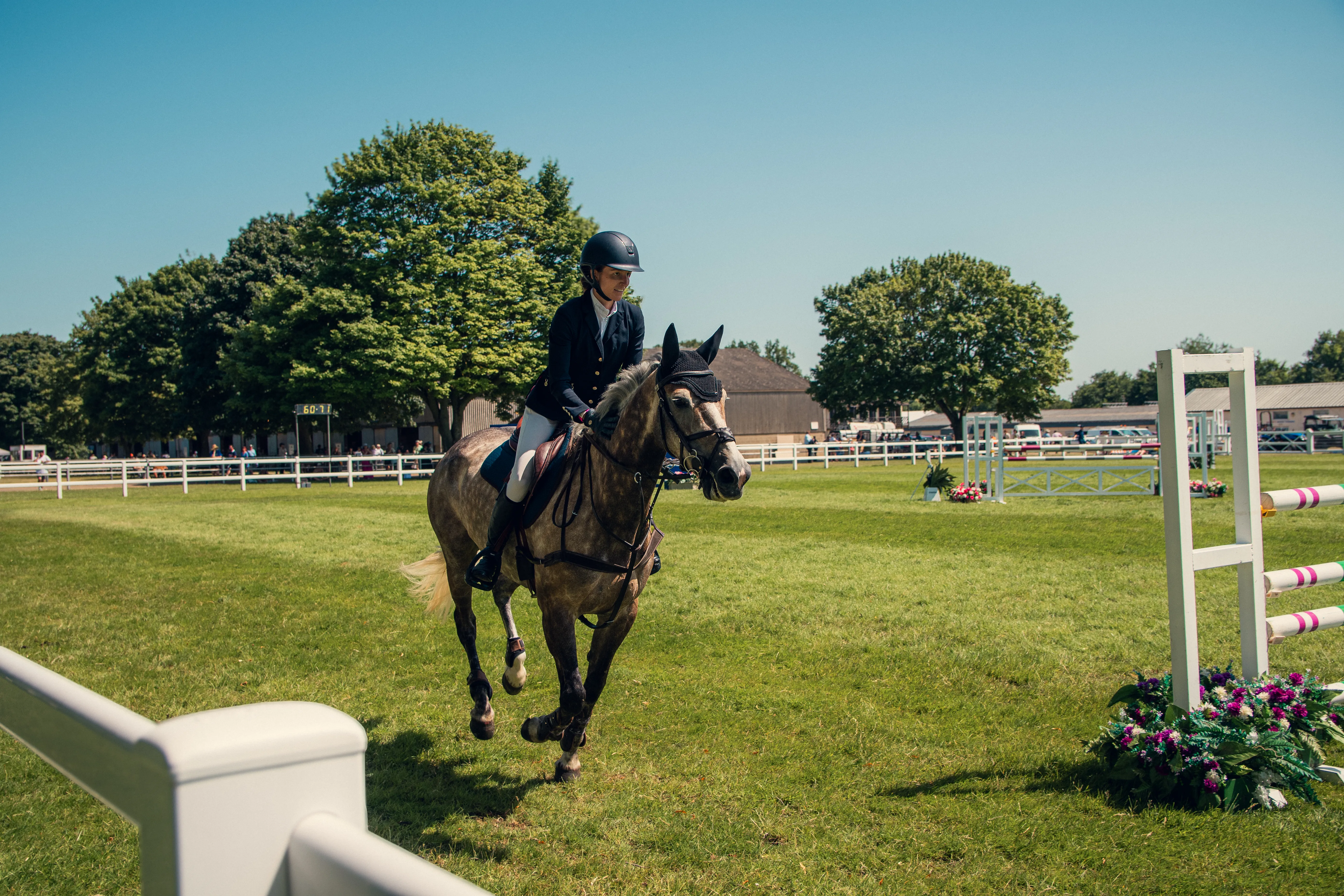 A horse and rider walking the course between fences.